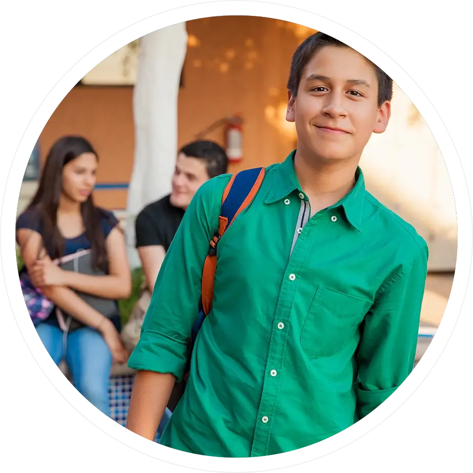 A man in green shirt and blue jeans.