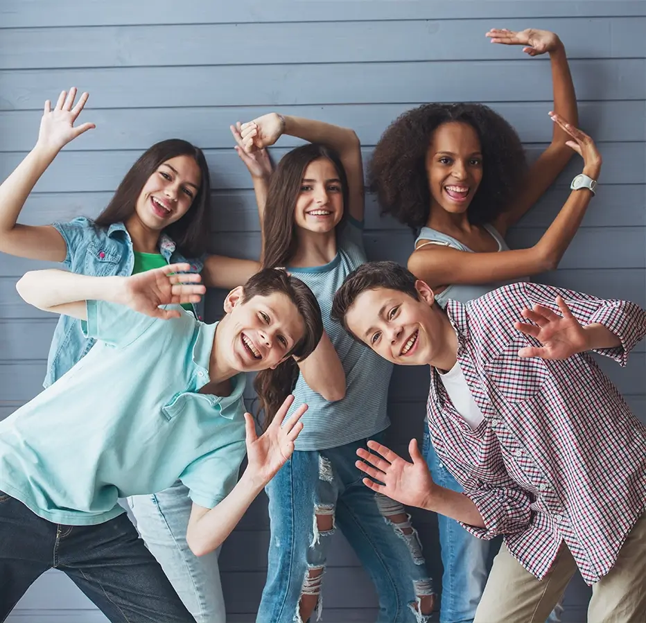 A group of young people posing for the camera.