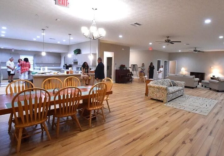 A large room with wooden floors and chairs.